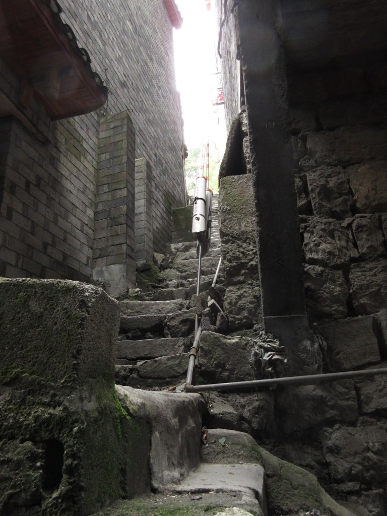 My favorite area of Jishou. Packed onto a steep riverbank without a road, its twisting narrow alleys feel like they're built on top of generations of human civilization